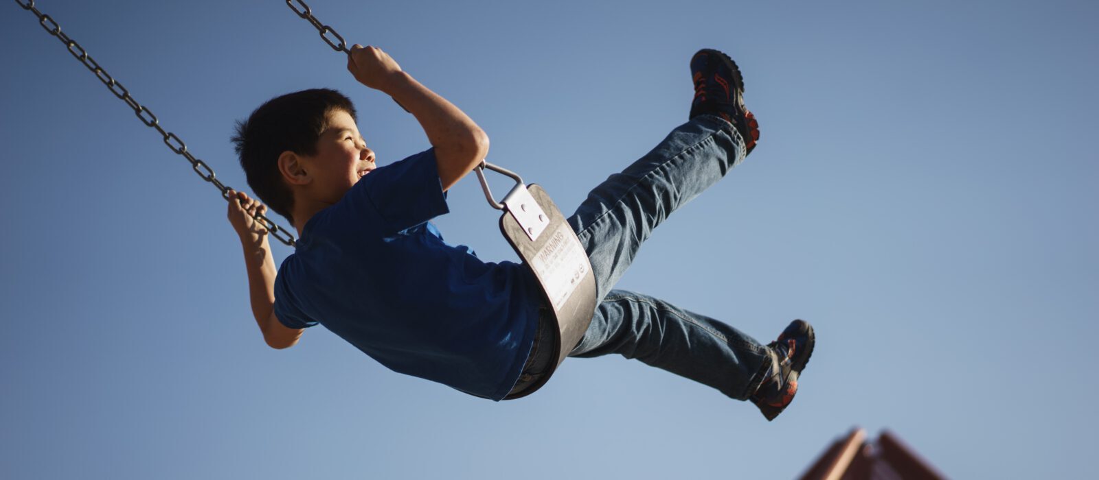 Kid on swing